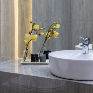sink with flower in bathroom